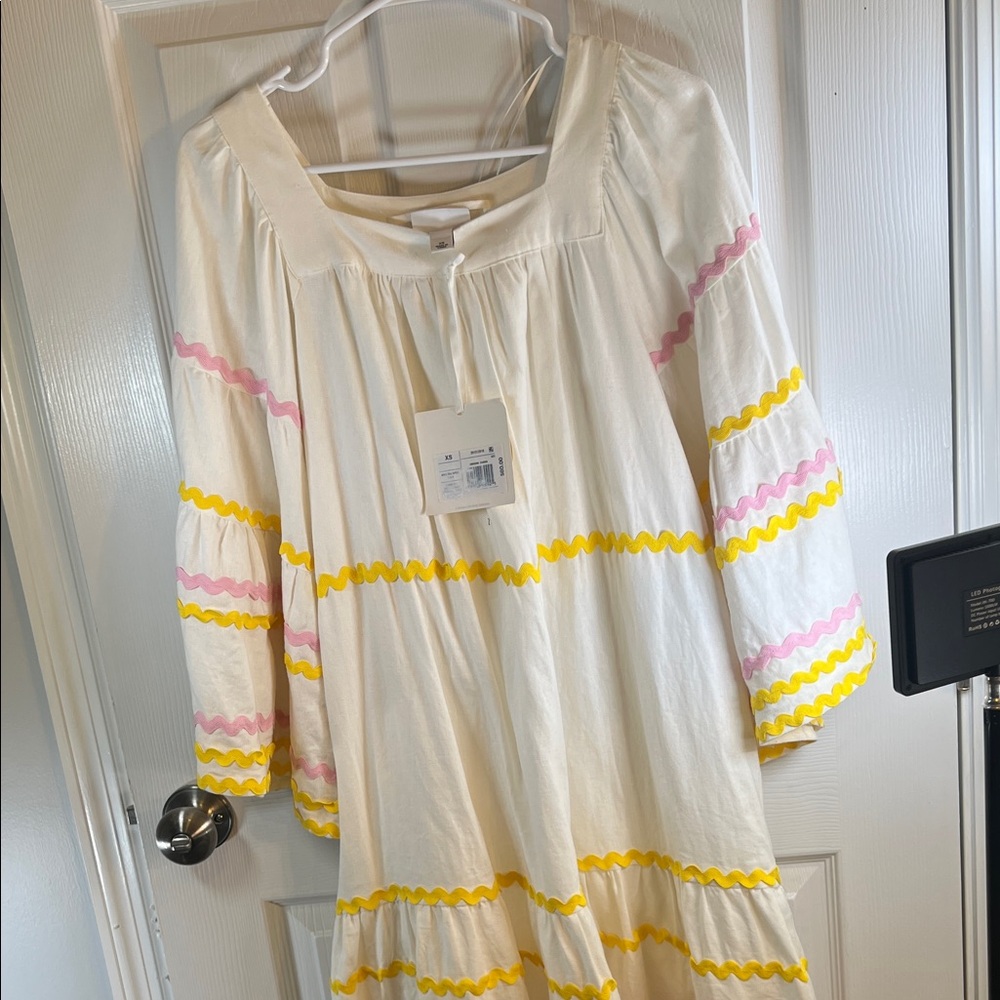 Charming White Dress with Pink and Yellow Accents